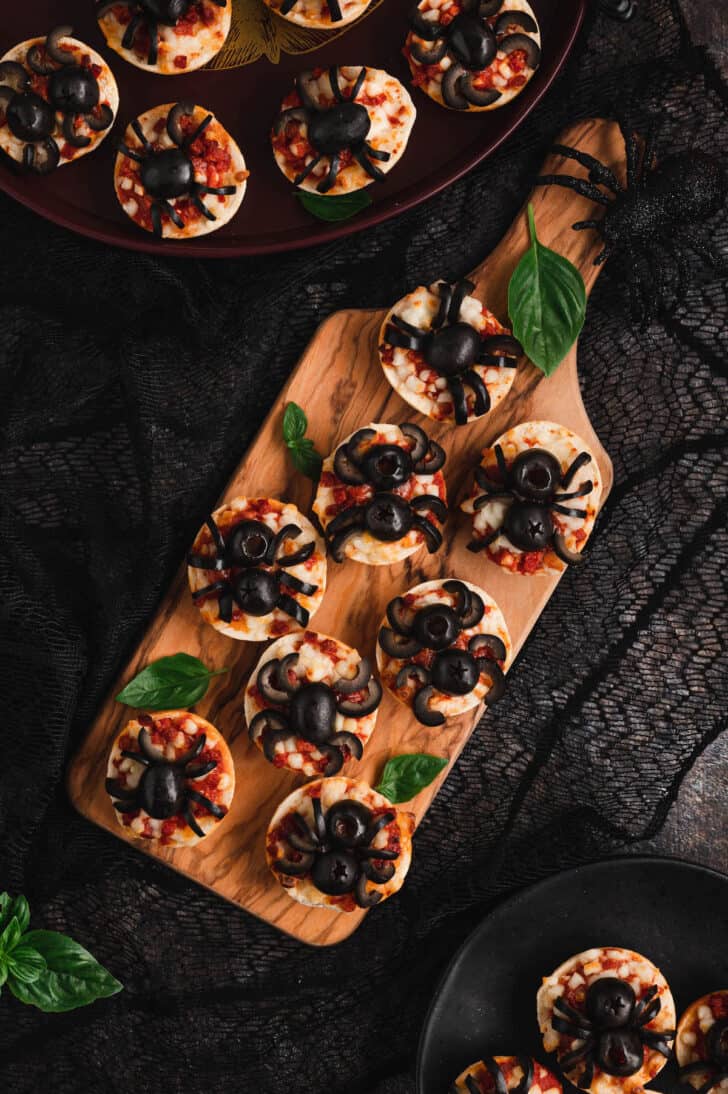 Spider bagel bites, made with mini pepperoni frozen bagels and black olives.