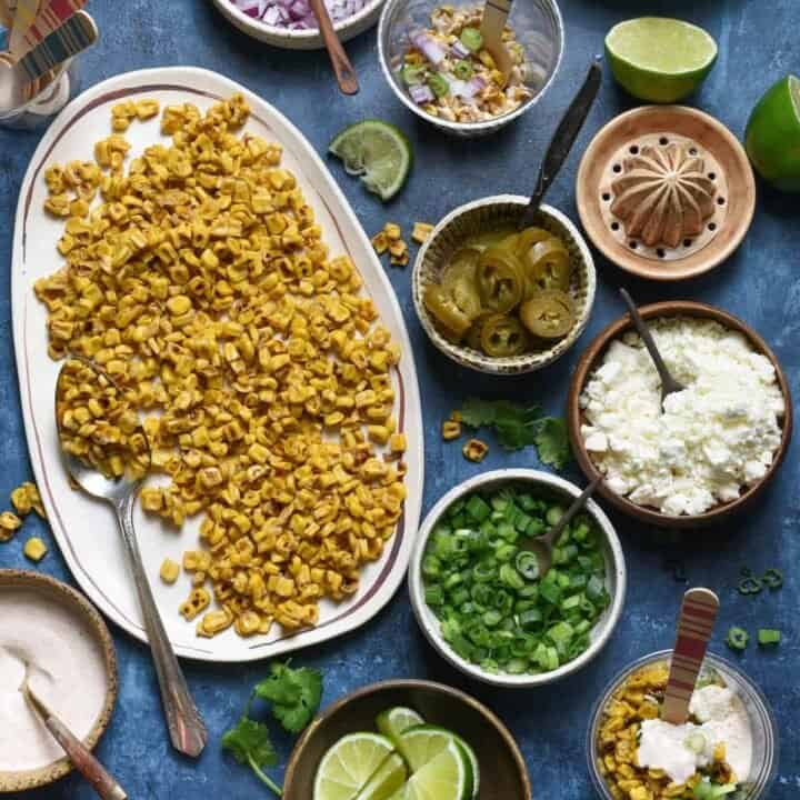 Having a fiesta? Please the whole crowd with this Mexican Street Corn Salad Bar. Gather all of the ingredients for classic Mexican street corn (elote), but let everybody assemble their own. Perfect for the spice lovers, the picky eaters, and the cilantro-adverse! | foxeslovelemons.com
